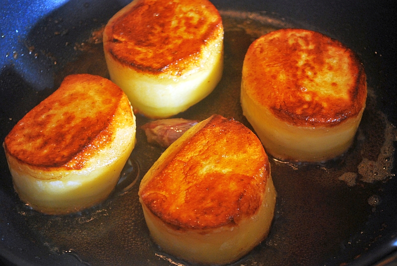 Fondant potatoes in a pan